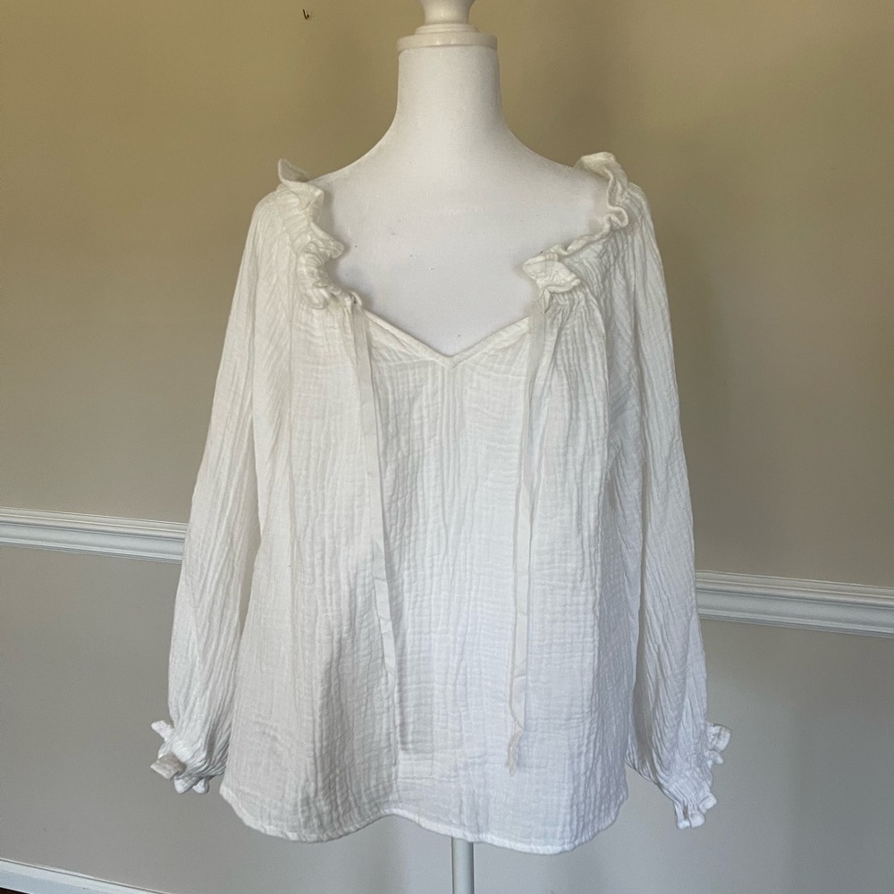All white blouse long sleeves but breathable.